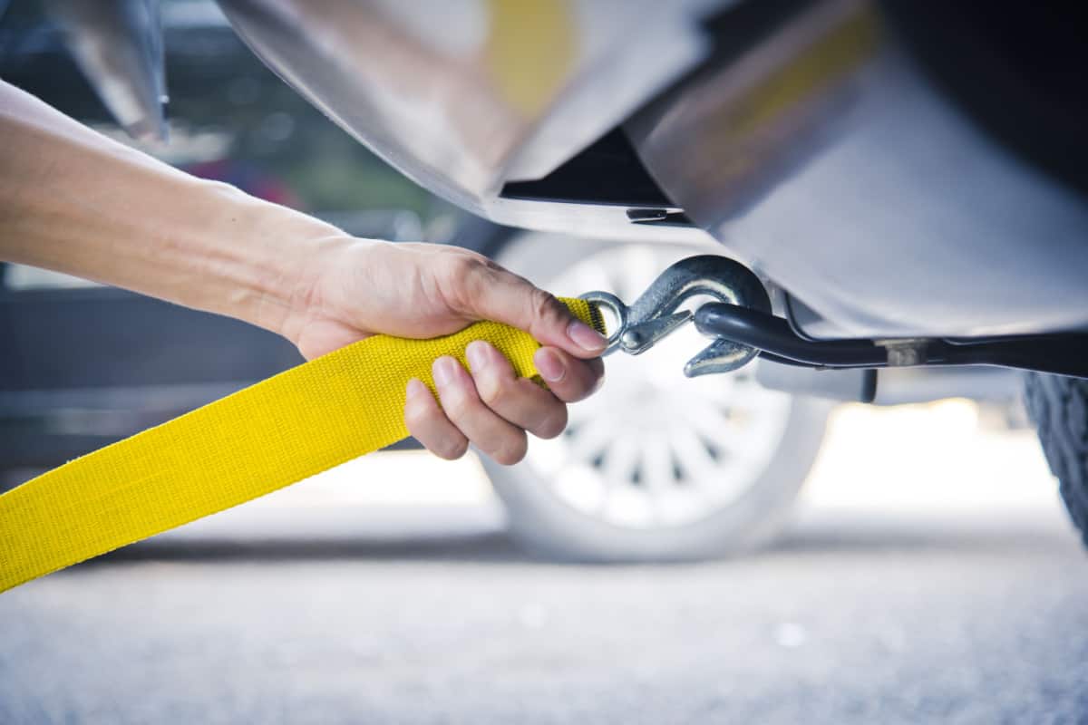 tow hook being put onto car